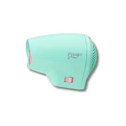 Mint green hair dryer with pink accents on a white background